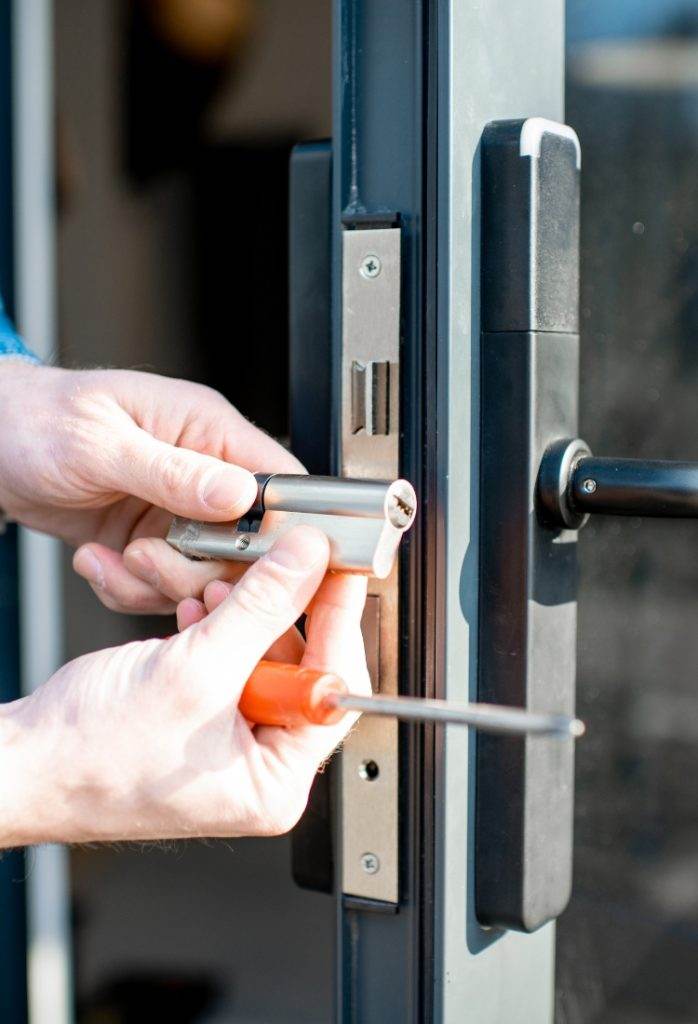 Lock installation in a modern home using tools for security enhancement and repair Lock installation in a modern home using tools for security enhancement and repair