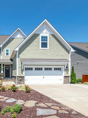 Affordable garage door enhances curb appeal of modern home in sunny neighborhood Affordable garage door enhances curb appeal of modern home in sunny neighborhood