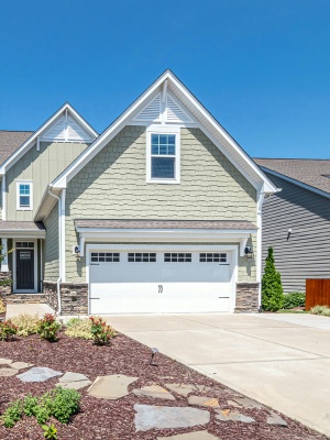 Custom steel garage doors enhance the curb appeal of homes in Edmonton, showcasing craftsmanship in residential design Custom steel garage doors enhance the curb appeal of homes in Edmonton, showcasing craftsmanship in residential design