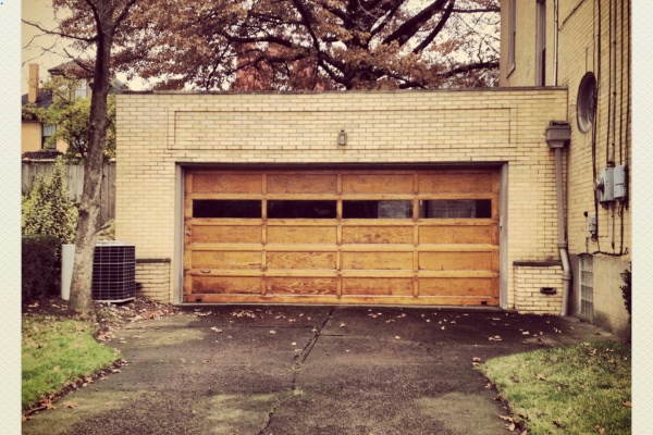 Durable wooden garage doors enhance the exterior appeal of homes in Edmonton during the fall season Durable wooden garage doors enhance the exterior appeal of homes in Edmonton during the fall season