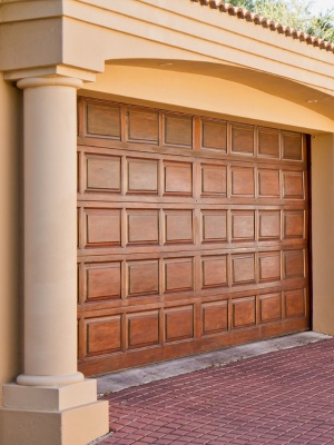 Beautiful wooden residential garage doors in Edmonton showcase charming architecture and detail Beautiful wooden residential garage doors in Edmonton showcase charming architecture and detail