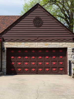 Wooden garage door replacement enhances curb appeal with modern design in residential neighborhood Wooden garage door replacement enhances curb appeal with modern design in residential neighborhood