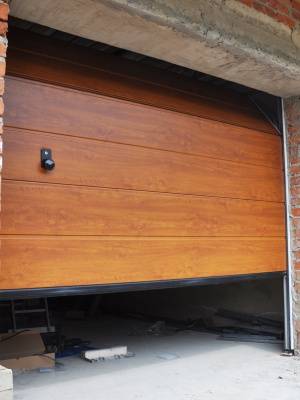Professional garage door maintenance in progress for smooth operation and durability